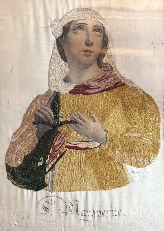 Gravure habillée figurant Sainte Marguerite et le dragon.